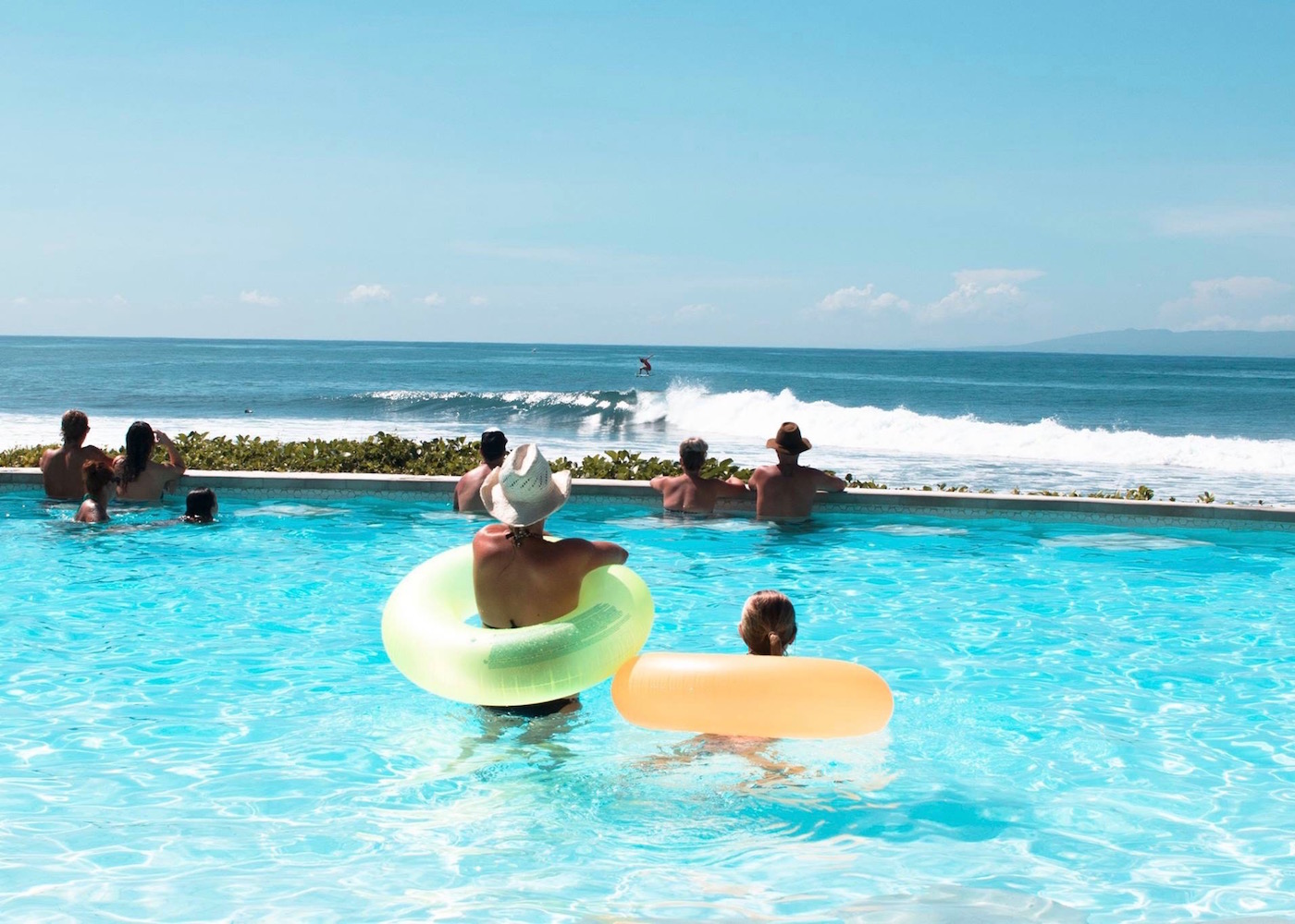 People watching the surf from Komune Beach Club in Keramas, East Bali