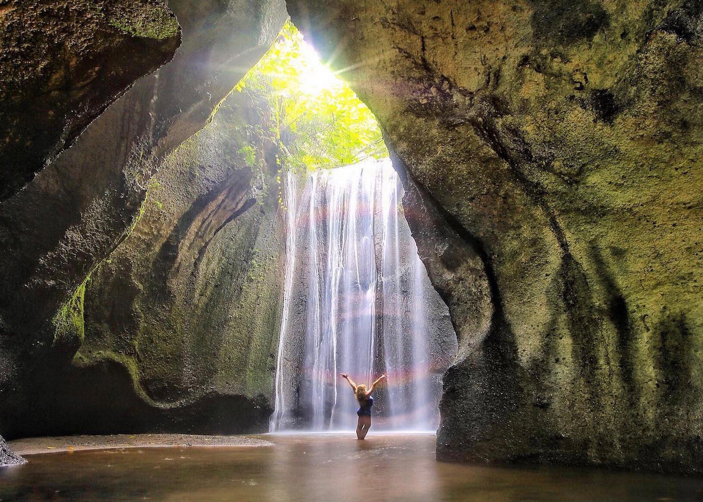 The sun rays at Tukad Cepung Waterfall - the must-visit places in Bali Indonesia