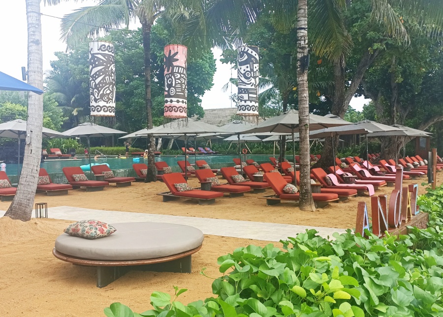 The beachfront pool and loungers at Andaz Bali hotel in Sanur