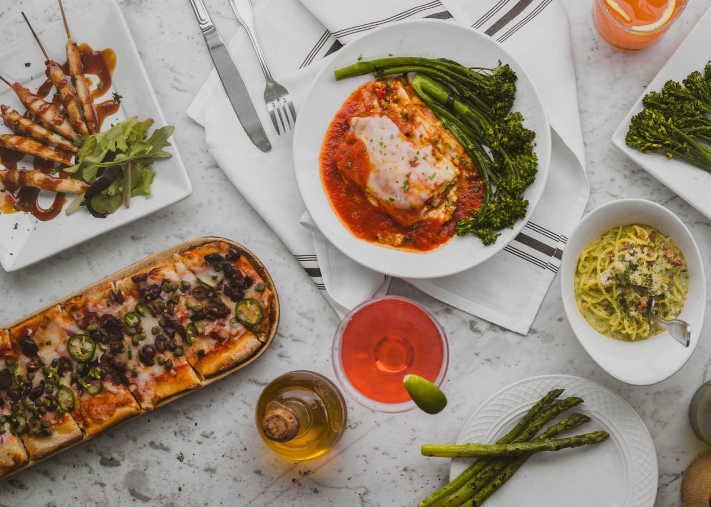 pizza and pasta on the table | best food delivery singapore