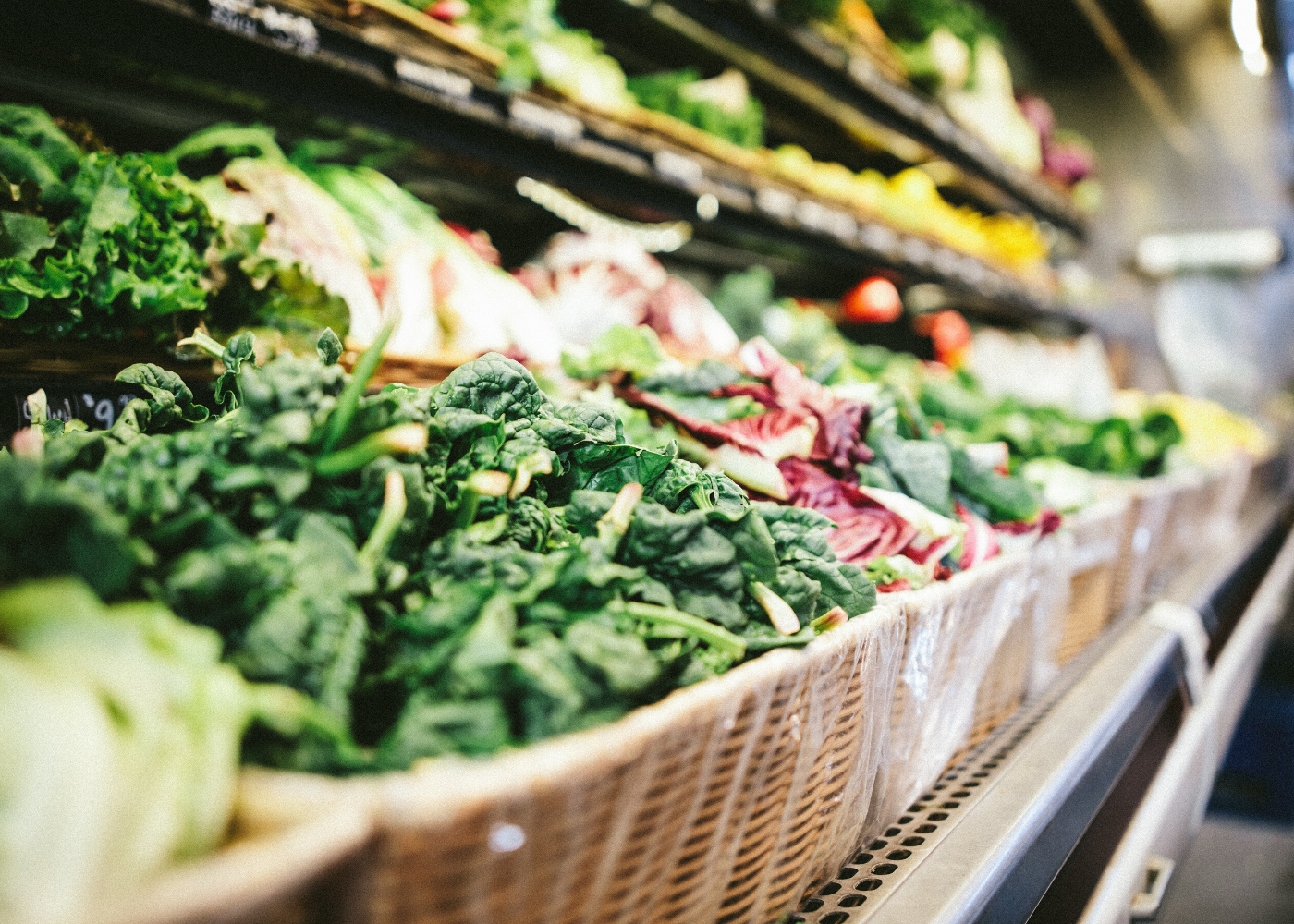 rows of vegetables in grocery store