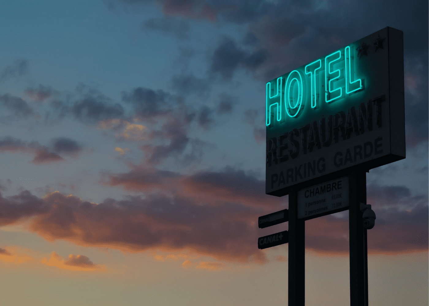creepy hotel neon sign