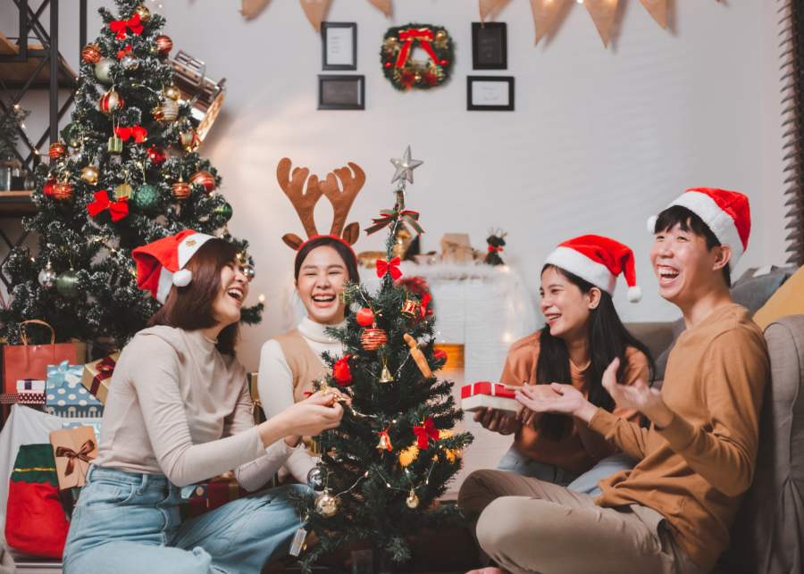 ultimate guide to christmas in singapore | friends exchanging gifts